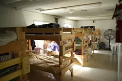 NO HOME OF THEIR OWN : Some SLO schoolchildren who are experiencing homelessness do some homework and eat their dinner at the Maxine Lewis Shelter, then move to a local church to sleep. - PHOTO BY STEVE E. MILLER