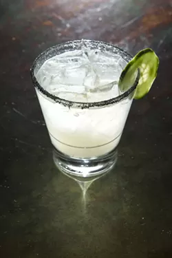BETWEEN THE SHEETS: A creation of Novo’s Matt Hanson, the mixture of top-shelf tequila, serrano peppers, and black lava salt makes The Latin Linen a spicy—but subtle—choice for any weather. - PHOTO BY STEVE E. MILLER