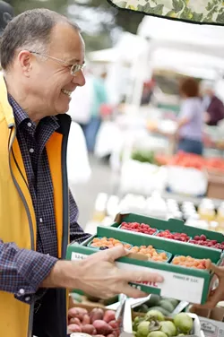 GETTING FRESH : Charles Myers insists on nothing but the best local vegetables and fruit for his Big Sky Cafe , and is there any better place to find them than the farmers’ market downtown? - PHOTO BY STEVE E. MILLER