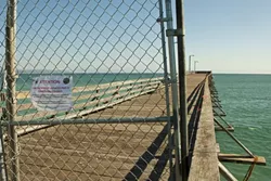 BARRICADED : Half of the Cayucos Pier was recently closed off to the public after a Tribune reporter and photographer raised questions about its safety. - PHOTO BY STEVE E. MILLER