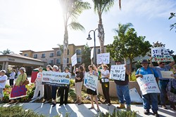 MAD ABOUT WATER:  Demonstrators showed up at a Sept. 21 DOGGR hearing to protest approval of a Freeport McMoRan application to exempt a local aquifer from the Safe Drinking Water Act. - PHOTO BY KAORI FUNAHASHI