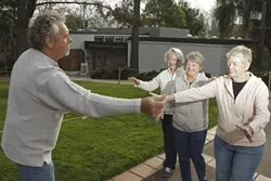 FOLLOW MY VOICE : Seasons of Creativity instructor Michael Ackerman and artists (left to right) Joan Faubert Suttle, Robin Johnson, and Flo Bartell reenact their first workshop, a sensorial awareness exercise.