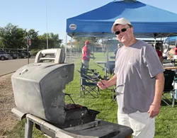 GRILL MASTERS : Winemakers cook up their best for the Paso Robles Winemakers’ Cook-Off, coming up Aug. 8. Rich Hartenberger of Midnight Cellars is pictured. - PHOTO COURTESY OF PASO ROBLES ROTARY