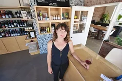 EXOTIC WINES MEET LOCAL LORE: Want to try a sauvignon blanc from Slovenia or get your hands on a rare local wine off the beaten path? The Station is SLO’s new unlikely neighborhood wine bar/hangout nestled in one of the area’s first service stations. Pictured, General Manager Jenna Congdon. - PHOTO BY KAORI FUNAHASHI