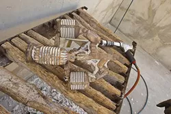 An air hammer is used remove medium and large sized chunks of mold from the bronze. - PHOTO BY STEVE E. MILLER
