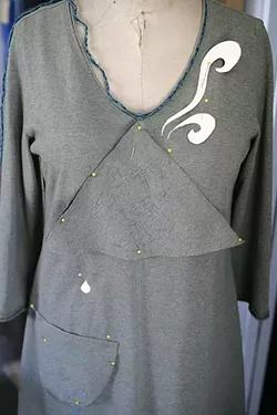 WORK IN PROGRESS: When done, this dress will feature a coffee pot pouring into a cup on a pocket, complete with rising steam, all utilizing the “Alabama Chanin” technique. - PHOTO BY GLEN STARKEY