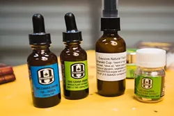 CBD THERAPY: Many of the products carried by Botanical Elements, a mobile dispensary that serves medical marijuana patients up and down the Central Coast, don’t have high amounts of THC in them. THC is the compound in cannabis that gives people a high. The therapeutic qualities of CBD, another cannabinoid compound found in marijuana, are what Botanical Elements tries to focus on. Products include pure CBD oil, tinctures and lotions that contain it, capsules, chocolates, and other edibles. The mobile dispenser also distributes various strains of marijuana in its most basic form, the bud. Different strains contain varying quantities of THC and CBD; each was created to treat a different illness. - PHOTO BY KAORI FUNAHASHI