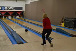 STRIKE: Pismo Beach City Council candidate Marcia Guthrie, seen here bowling during her election night event, is locked in a dead heat with incumbent Mary Ann Reiss for a council seat as of Nov. 5. Both candidates are awaiting the tabulation of about 850 uncounted ballots in Pismo. - PHOTO BY RHYS HEYDEN