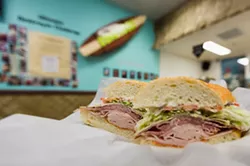 THE DESTROYER CHALLENGE IS ON: Scarf two of these bad boys down in less than more 17 minutes and you could earn your photo on the Kona’s Deli wall. Talk about bragging rights! - PHOTO BY KAORI FUNAHASHI