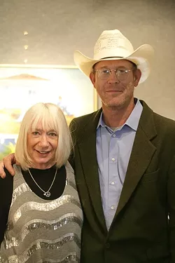 IN THE VAULT! : Vault Gallery owner Laylon shares an embrace with her featured artist, Mark Beck, at the Saturday opening reception. - PHOTO BY GLEN STARKEY