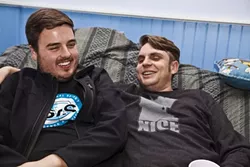 BOND OF WRITERS: Staff writers Rhys Heyden and Jono Kinkade get comfortable together on the giant beanbag in the living room. - PHOTO BY COLIN RIGLEY