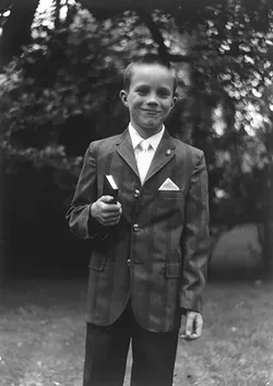 THEN: John C. Hampsey, seen here as a 7-year-old after his first communion, writes of boyhood events between age 7 and 14. - PHOTO COURTESY OF JOHN C. HAMPSEY