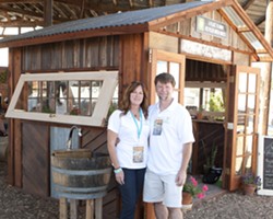 BEAUTIFUL RECYCLING:  A Place to Grow creates custom-made greenhouses out of recycled materials that&rsquo;ll make any yard look fantastic. Pictured here are the owners Dana and Sean O&rsquo;Brien with a greenhouse showcased at the Sunset Savor the Central Coast event in Santa Margarita. - PHOTO BY STEVE E. MILLER