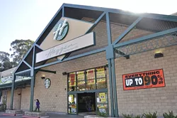 CLOSED FOR THE HOLIDAYS: The Johnson Avenue Haggen store in San Luis Obispo advertises an up-to-90-percent-off sale before they closed their doors. Six Haggen stores in San Luis Obispo County have closed and gone up for sale, leading to approximately 400 layoffs. - PHOTO BY JONO KINKADE