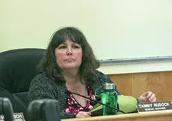 TORCHES AND PITCHFORKS : Former Cambria Community Services District general manager Tammy Rudock (pictured) sat an April 28 board of directors meeting, approximately 24 hours before being canned. Not pictured are the approximately 300 residents calling for her immediate termination. - PHOTO BY MATT FOUNTAIN