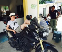 LAID BACK: Heather Johnson (left) rests on her Triumph Tiger in La Venta, Tabasco, Mexico after it broke down when she hit a pothole. - IMAGE COURTESY OF HEATHER JOHNSON