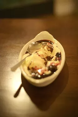 COURSE SIX : The evening concluded with ice cream topped with dark cherries and chocolate sauce. - PHOTO BY GLEN STARKEY