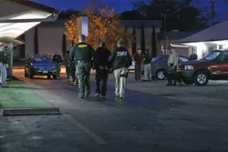 BUSTED : The SLO County Sheriff’s Department played host to a slew of law enforcement agencies from out of the area—including the FBI, who was running the show—in a massive effort to round up a gang-operated narcotics ring. New Times had an exclusive front-row seat. - PHOTOS BY STEVE E. MILLER