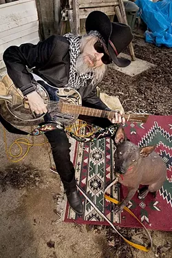 A BOY & HIS DOG: Alt-country singer-songwriter and raconteur extraordinaire Phil Lee (here with his hairless dog Lucy) plays April 25 at Steynberg Gallery. - PHOTO COURTESY OF PHIL LEE