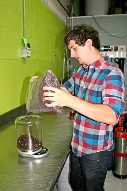 TO A TEA: Jake Pritzlaff of Whalebird Kombucha measures fragrant black tea from Secret Garden Organic Herb Shop in SLO. With just the right ingredients and a 30-day ferment, this tea will transform into tart, refreshing kombucha full of probiotic health benefits. - PHOTO BY HAYLEY THOMAS