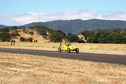 BARN FRESH : Justin Jurgens, part owner of British Sports Car in SLO, pilots Willie Chambers’ racer, which was pulled out of a barn in See Canyon a few years ago. - PHOTO BY GLEN STARKEY