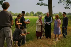 ON THE SET : Paul Cotter (wearing the baseball hat) spent 28 days in a German village filming Bomber - PHOTO COURTESY OF PAUL COTTER
