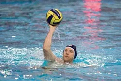 NICE HAT! : SLO Olympian Jeff Powers fields a ball during a water polo match. - PHOTO BY JEFF SHEWMON