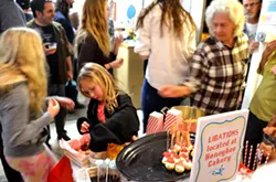 FOOD GLORIOUS FOOD!: Courtesy of HoneyBee Cakery, Bunker resident Liz Nagel, the Spring Art Spectacular featured quite the delicious spread of goods and sweets, from strawberry shortcake pops to chocolate truffles and popcorn. - PHOTO BY JESSICA PEÑA