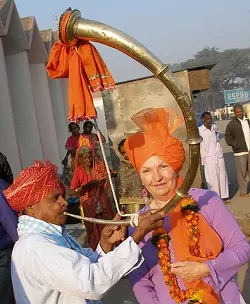THE ILLUSTRIOUS AUTHOR : The Joy of Sexus author Vicki Leon traveled extensively and took up odd jobs in several countries throughout the Mediterranean before she began writing about the ancient world. Here, she’s pictured on a trip to India. “I immediately noticed that the horn players were using a ‘cornu,’ the ancient Roman horn that was played in the gladiatorial arena as well as in military settings,” Leon writes of this photograph. “So there I am, squinting in the early morning sun and thrilled with finding yet another clue to the antiquity I so love.” - PHOTO COURTESY OF VICKI LEON