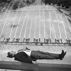 DAY DREAMER : Tress captured this dozing businessman in San Francisco’s Union Square. - PHOTO BY ARTHUR TRESS