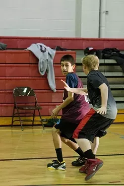 FULL PRESS : Eighth grader Arturo Resendez faces a defender during an early morning scrimmage over winter break.
