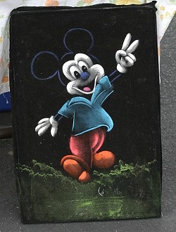 WINNER OF THE KITSCH AWARD! :  A painting of Mickey Mouse? Giving the peace sign? On black velvet? Oh yeah, baby! - PHOTO BY GLEN STARKEY