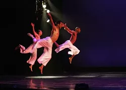 TRIO IN FLIGHT : A rare sight; the county has a dearth of male dancers. - PHOTO BY KEITH MOSHER
