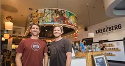 ARE WE HUMANS OR ARE WE ARTISTS?: Co-artists, business owners, and friends Jimmy apRoberts and Brian Christopher have gone back and forth, somewhat blindly, to create 72 panels of their Exquisite Corpse piece over the last 10 years. - PHOTO BY KAORI FUNAHASHI