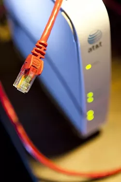 AT YOUR SERVICE? : As AT&T unveils new fees for customers who exceed certain bandwidth limits, consumer advocates cry foul and customers wonder if they’ll be affected. - PHOTO BY STEVE E. MILLER