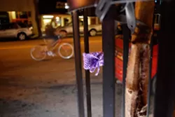 KNIT TAGGING : A knit tag adds a spot of color to an otherwise normal street scene in downtown SLO. - PHOTO BY STEVE E. MILLER