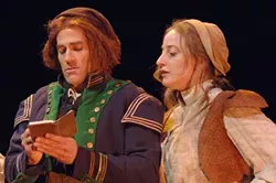 COOKING UP THE BOOKS : Andrew Philpot and Elizabeth Stuart provide welcome laughter and color as Thenardier and Madame Thenardier. - PHOTO BY LUIS ESCOBAR/ REFLECTIONS PHOTOGRAPHY STUDIO
