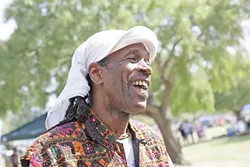 EARTH DAY SMILES : Everyone had a great time, including local musician Al “Shival” Redwine, at Earth Day. - PHOTO BY GLEN STARKEY