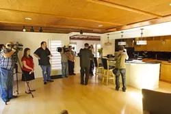 THE GRAND TOUR : Cal Poly President Jeffrey Armstrong (center, back to the camera) shows local media what $337,000 in renovations looks like. - PHOTO BY STEVE E. MILLER