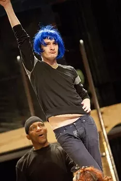 WORK IT! : Brandon Pascal (above, in blue wig) rehearses a scene from Rent, in which he portrays the flamboyant, HIV-positive drag queen Angel. After Tom Collins (Jimmy Thornton, also pictured) is mugged on the streets of New York City, Angel comes to his aid, and romance blooms. - PHOTO BY STEVE E. MILLER