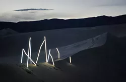 BRIGHT LIGHT: Illume no. 1, a radiant photo collection crafted by SLO design duo Matt Shara and Kory Worl, is on display now at Kreuzberg through August. Pictured, the artists’ bright installation glows against a Panamint Springs desert backdrop. - PHOTO COURTESY OF MATT SHARA AND KORY WORL