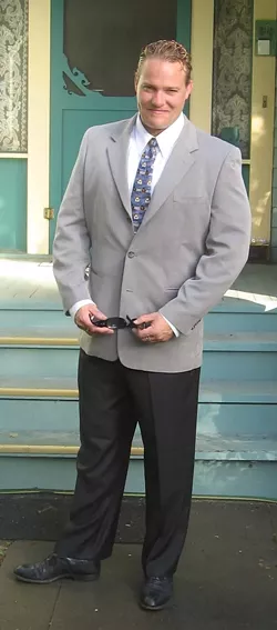 GRADUATION : Joshua Houlgate graduated from Cal Poly in 1995 with a bachelor’s degree in sociobiology and minor in psychology. This picture was taken just before his graduation ceremony. - PHOTO COURTESY OF HOULGATE FAMILY