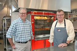 FAMILY STYLE: From left, SLO Provisions co-owners Steve Bland and Dwyne Willis discovered the joys of rotisserie meats during their travels to France. - PHOTO BY HAYLEY THOMAS