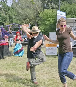 NINJA DANCER : Local artist and filmmaker Timo Beckwith boogied down with an unidentified female companion. - PHOTO BY GLEN STARKEY
