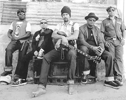 PEACEFUL WARRIOR : Protest and pacifism combine with a powerful pulse in the music of Michael Franti and Spearhead, headlining the Green Music Festival at the Pozo Saloon on Saturday, Sept. 20. - PHOTO COURTESY OF MICHAEL FRANTI AND SPEARHEAD