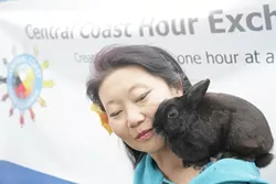 HOUR EXCHANGE WANTS YOU! : Briana Shean and her little bunny Bartholomew explain all about the Central Coast Hour Exchange. - PHOTO BY GLEN STARKEY