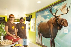 MEESES? :  Owners Amy Dillinger and Kevin Medici pose with a giant spraypainted moose mural created by Adam Moorhead of Southern California. - PHOTO BY STEVE E. MILLER