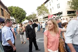 RUNAWAY WEDDING PARTY : A desperate groom, Raoul (Colin Rigley) and embarrassed groomsman, Matt, pursue the bride through Farmer’s Market. - PHOTO BY STEVE E. MILLER