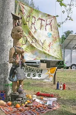 WORSHIP HER! : A shrine erected to celebrate Mother Earth flanked one side of the stage. - PHOTO BY GLEN STARKEY
