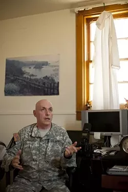 WARZONE GURU : With “more degrees than a rectal thermometer,” Chaplain Timothy Meier combines neural chemistry, psychology, and spirituality to teach soldiers how to remain emotionally resilient on the battlefield. - PHOTO BY STEVE E. MILLER
